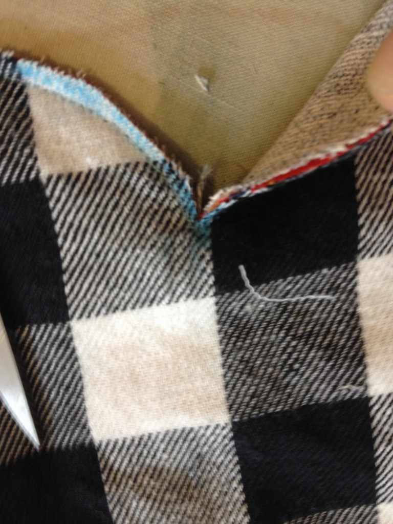 Snip straight down to the corner, without cutting the seam